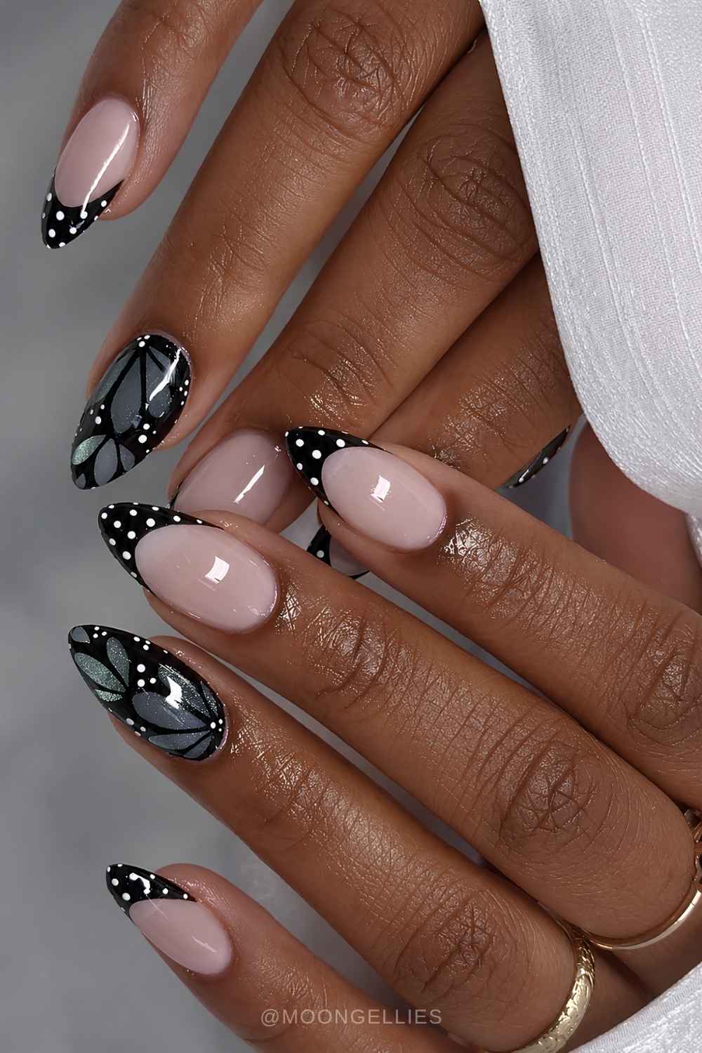 Black polka dot French mani with butterflies