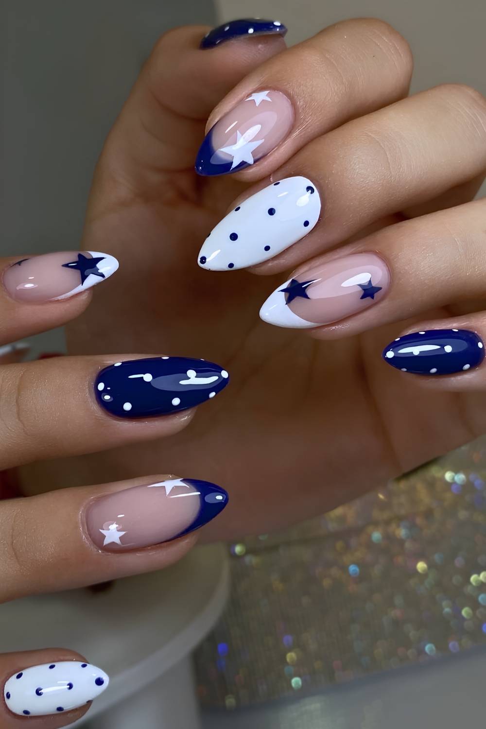 Blue and white nails with dots and stars