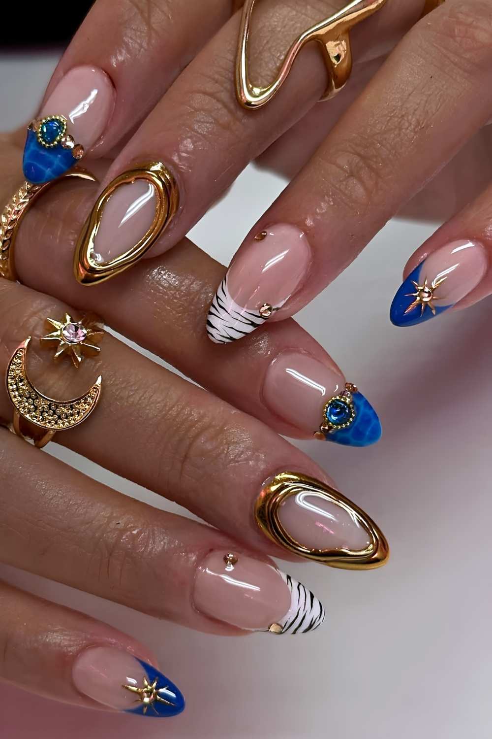 Blue nails with animal print and gold details