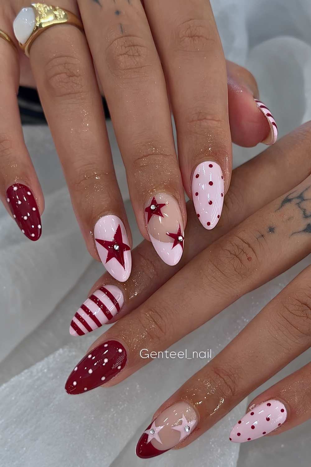 Burgundy and pink nails with dots and stars
