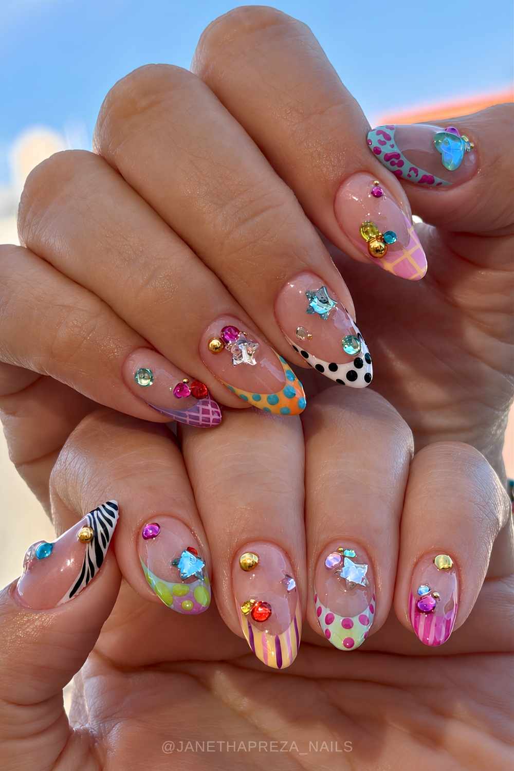 Colorful patterned French mani with gems