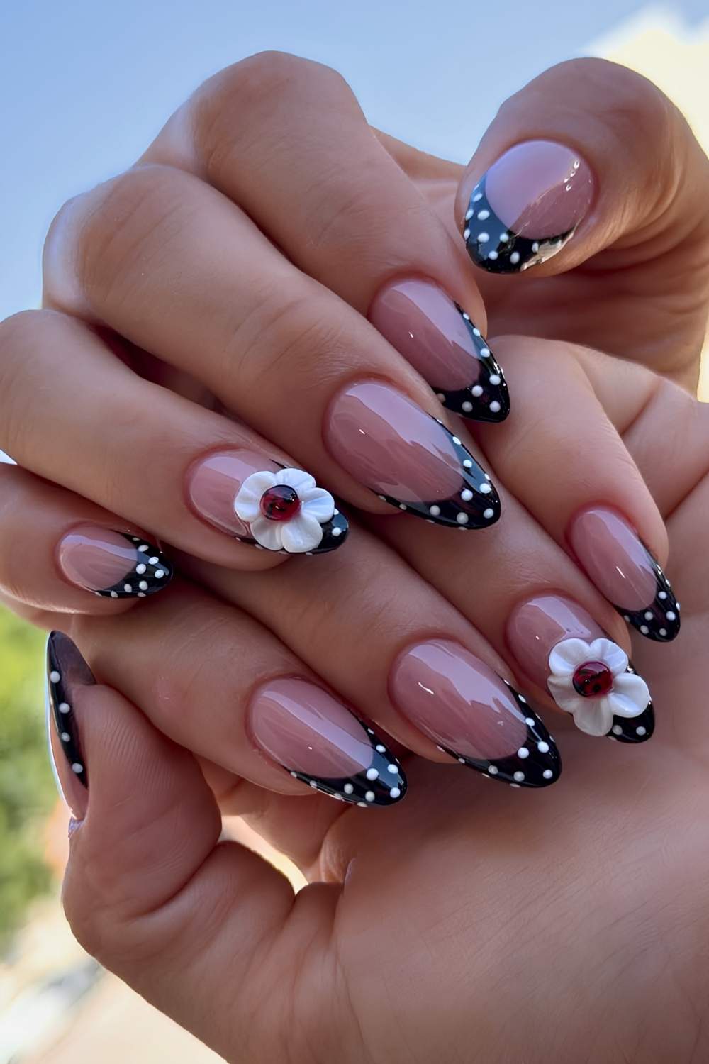 Dotted black French mani with ladybugs