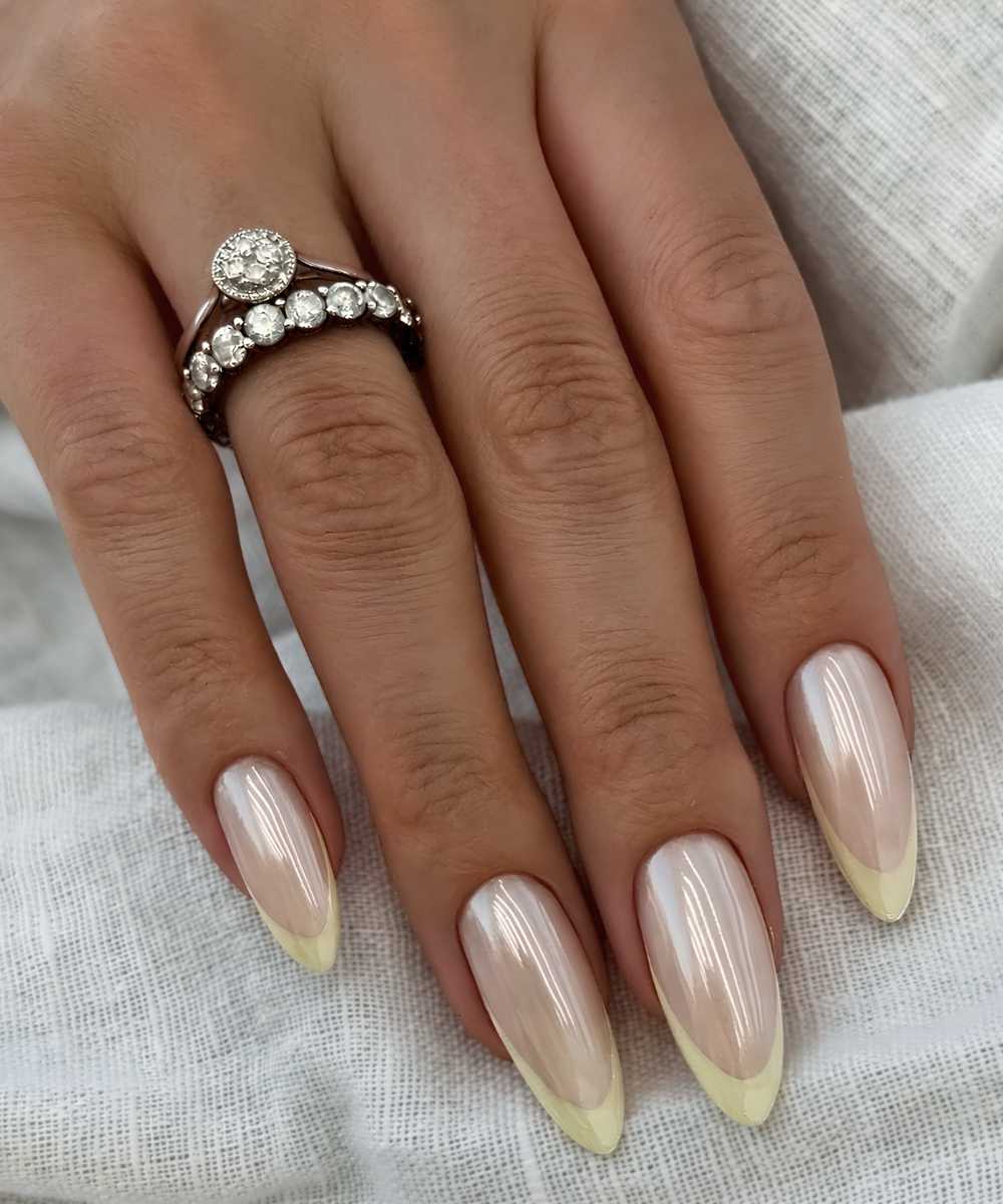 Glazed pastel yellow French manicure