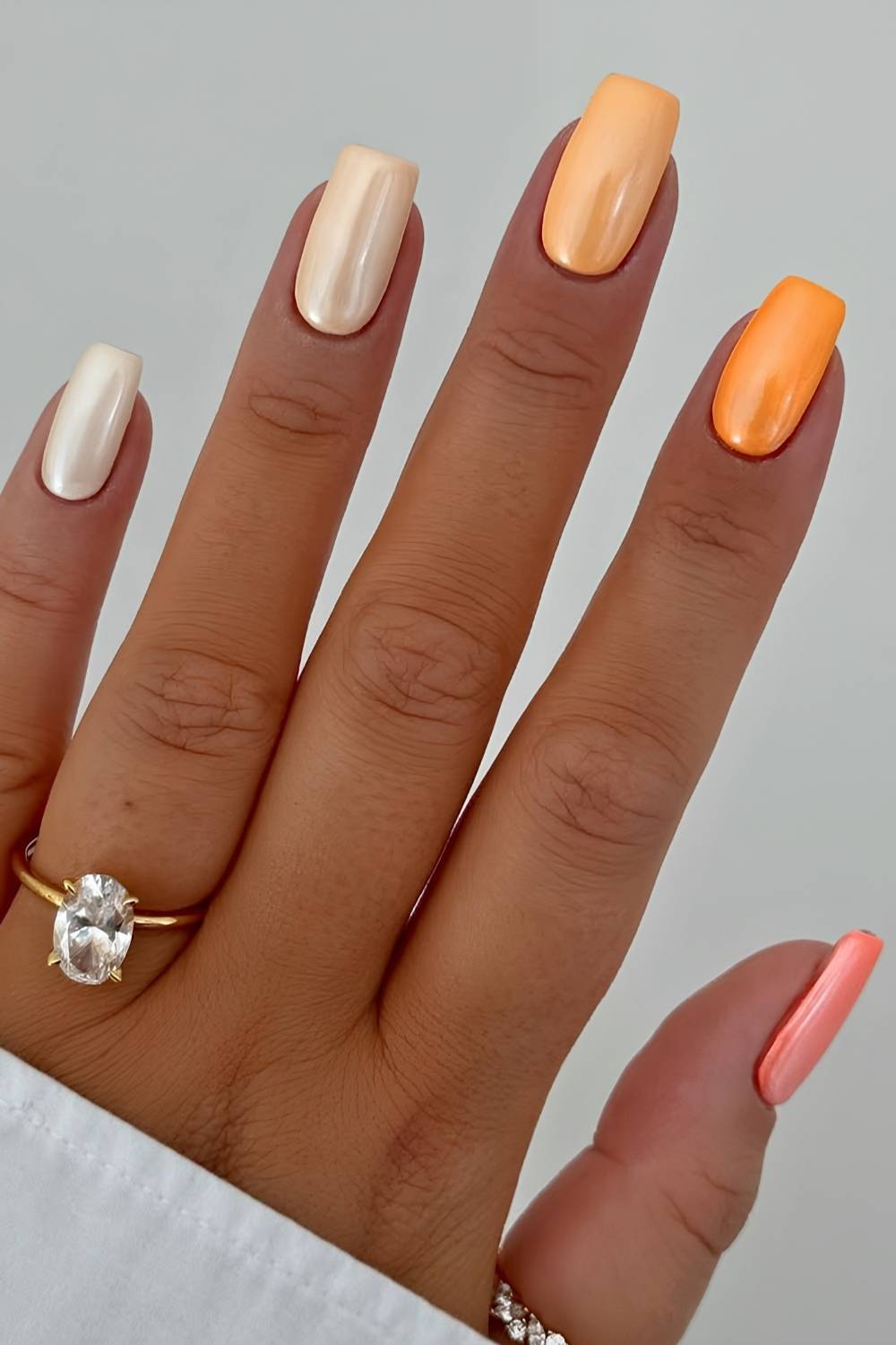 Glazed peach skittle manicure