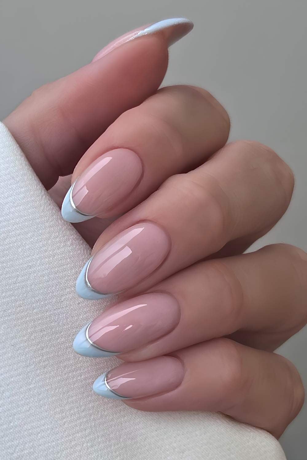 Light blue French mani with silver outlines