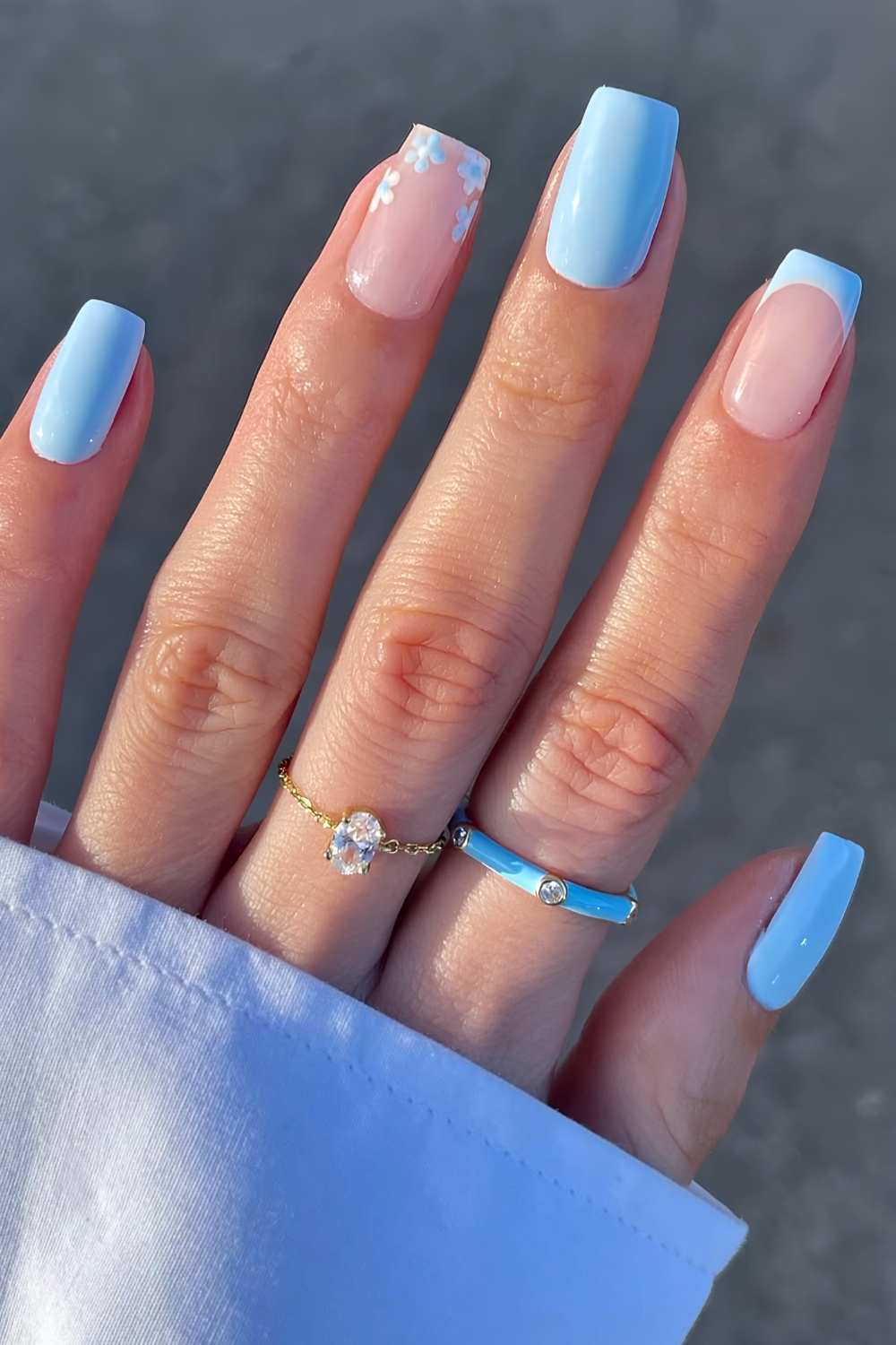 Light blue nails with micro daisy accents
