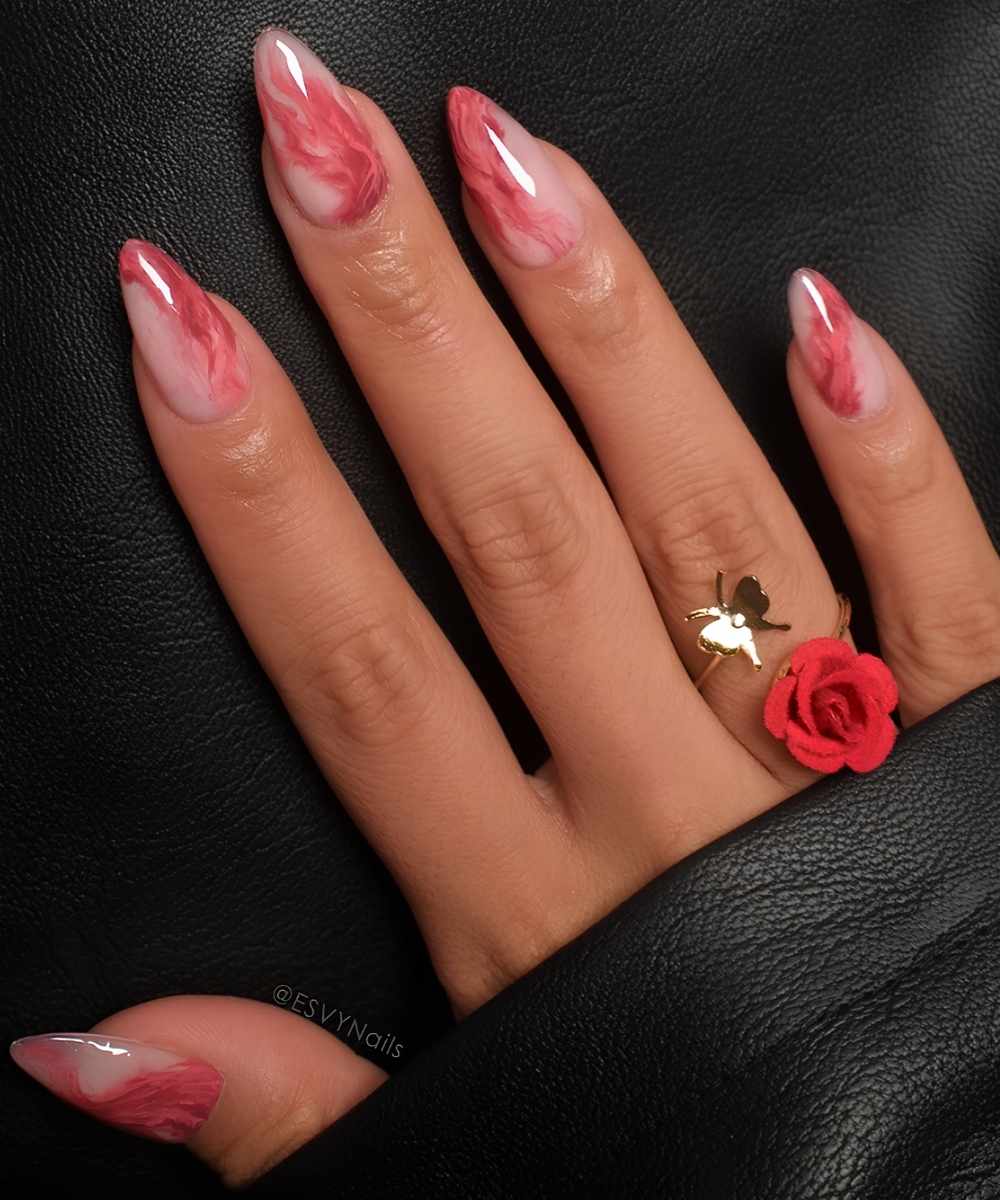 Milky mani with accent red marble