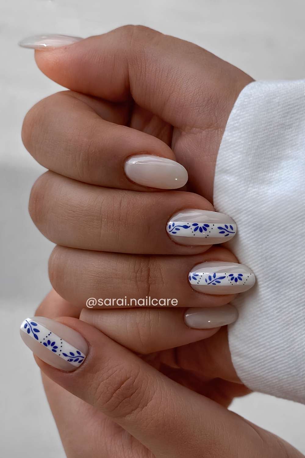 Milky mani with blue mediterranean florals