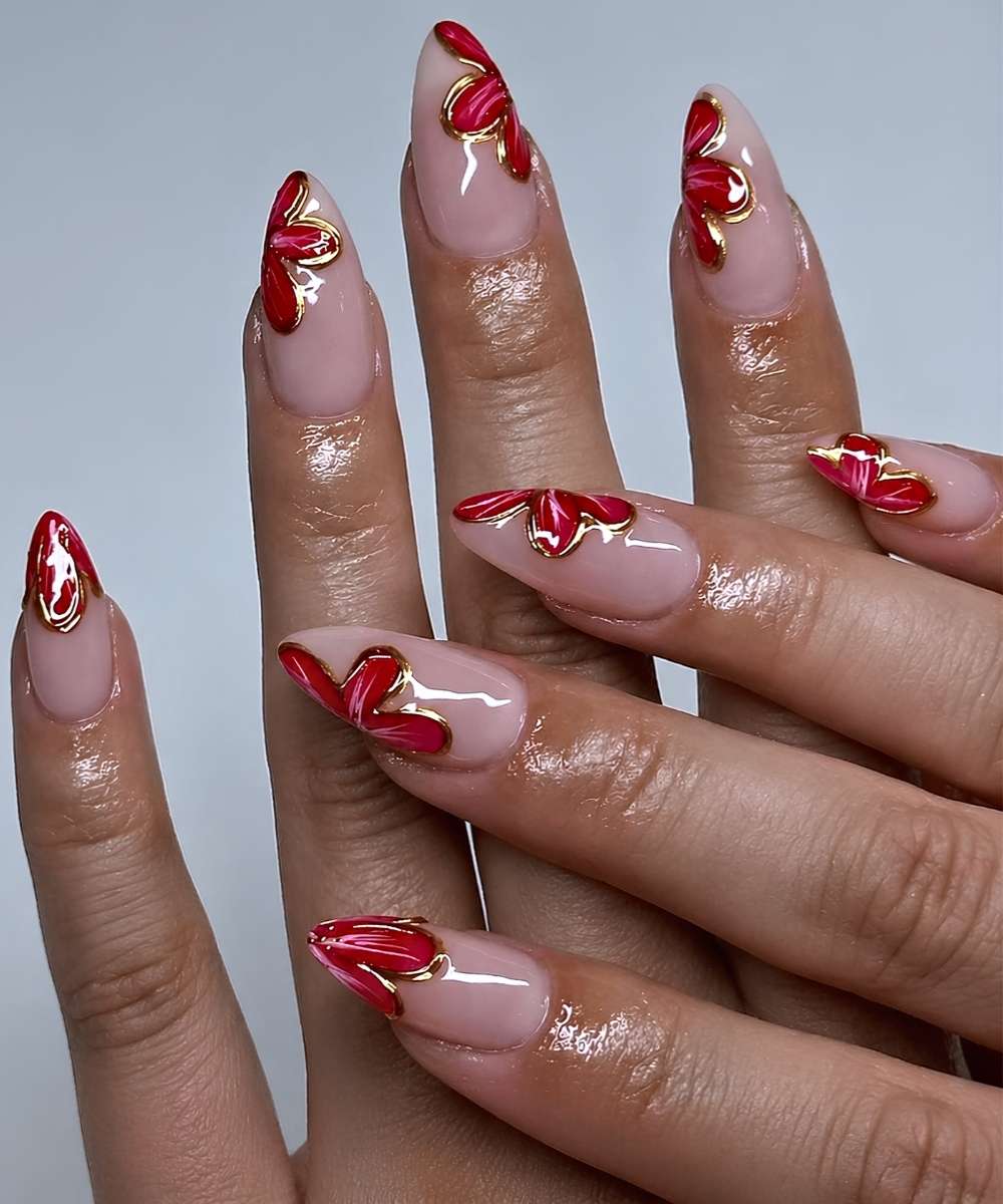 Milky nails with red and gold floral art