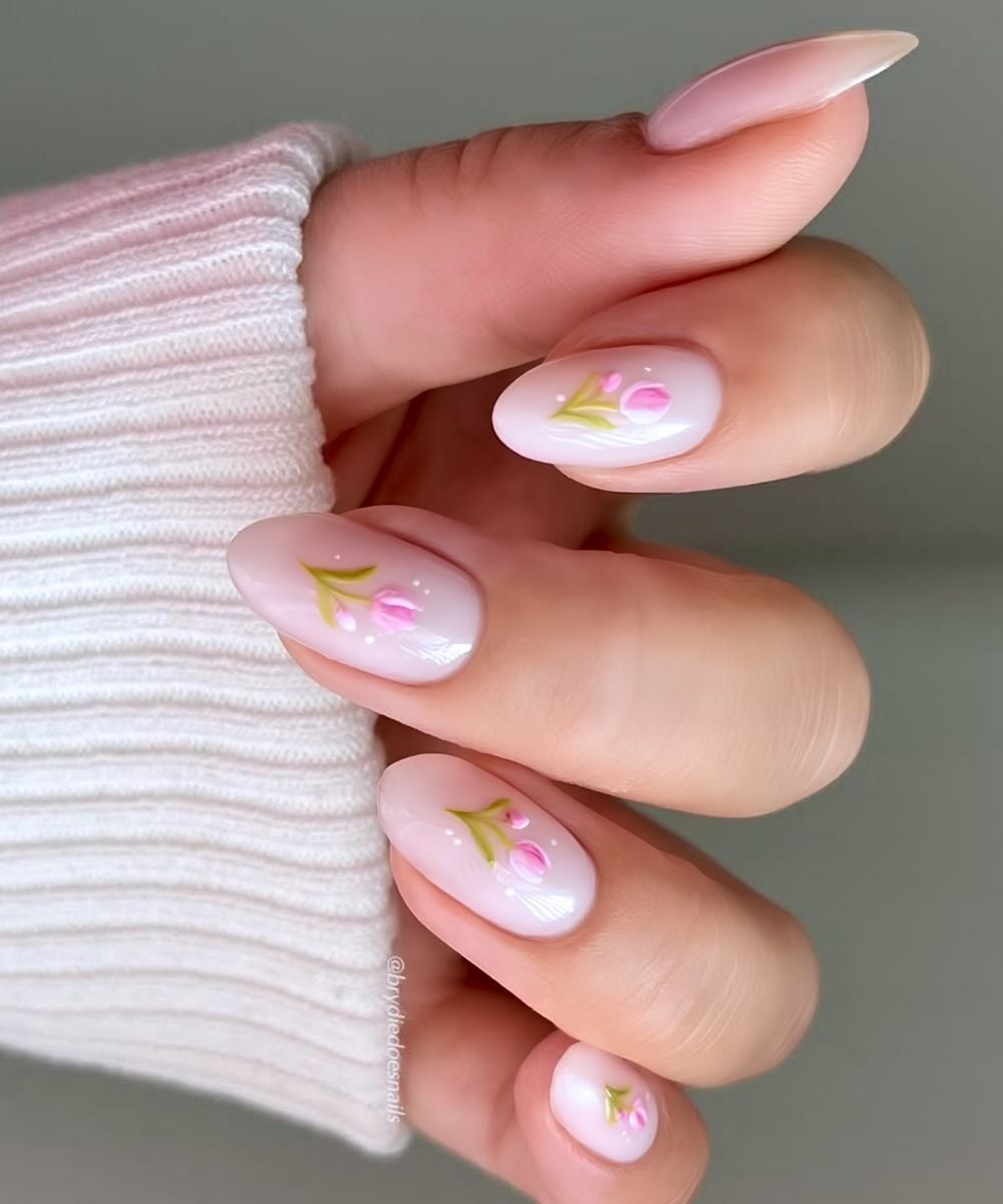 Milky white manicure with pink tulips
