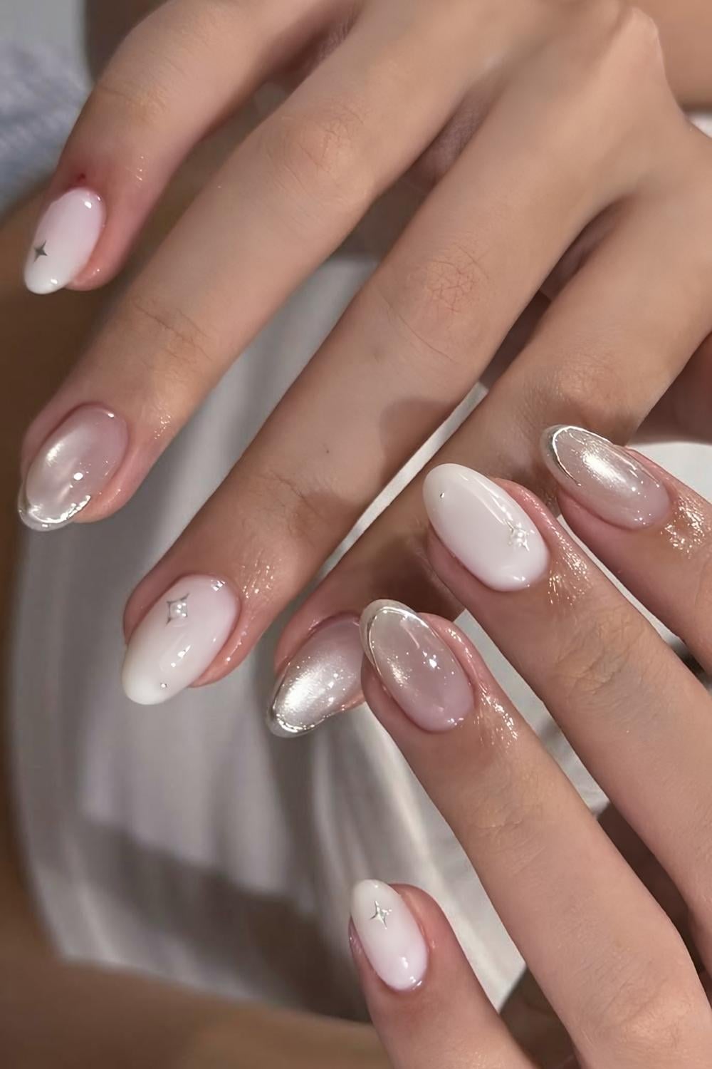 Milky white nails with accent cat eye