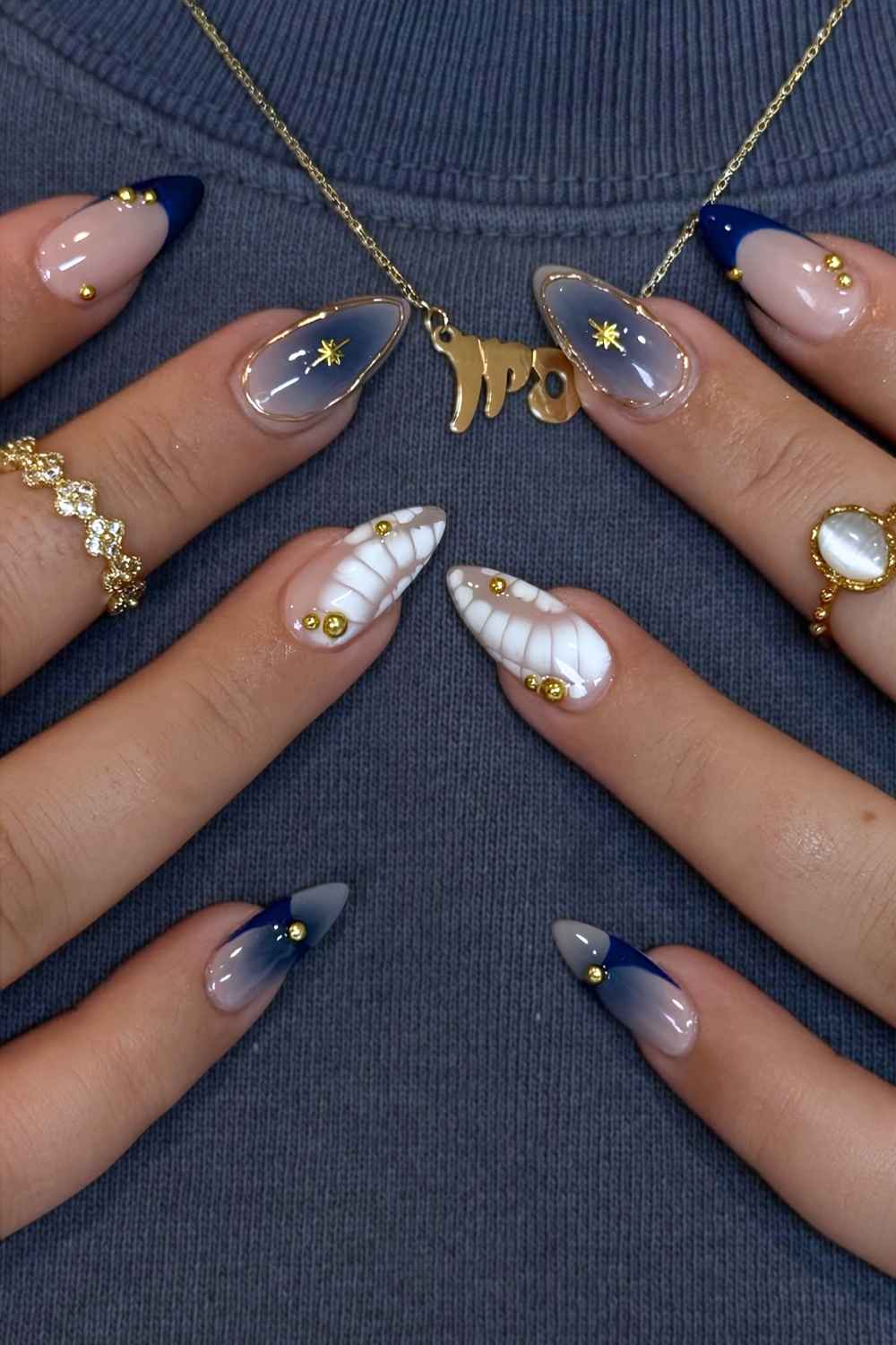 Navy and white mani with gold and animal print accents