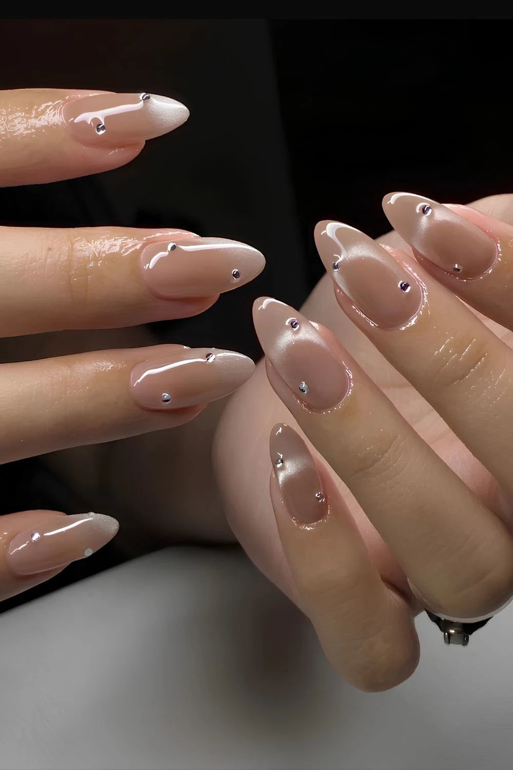 https://thepinkissue.com/wp-content/uploads/2025/04/Neutral-cat-eye-nails-with-rhinestones.jpg.webp?utm_source=chatgpt.com