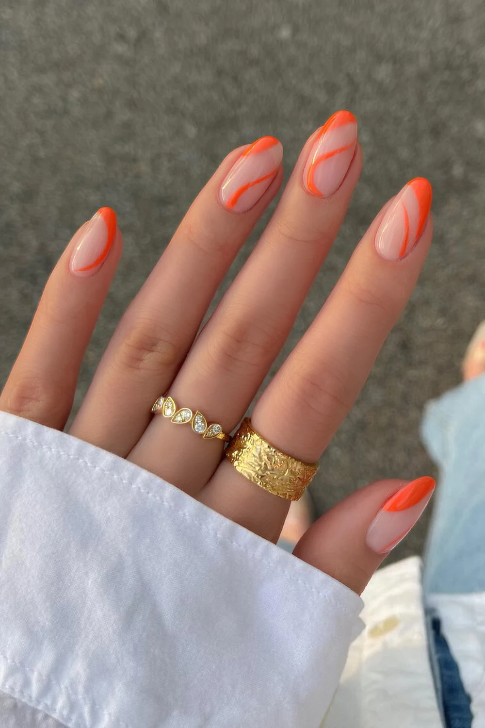 Neutral mani with orange swirls