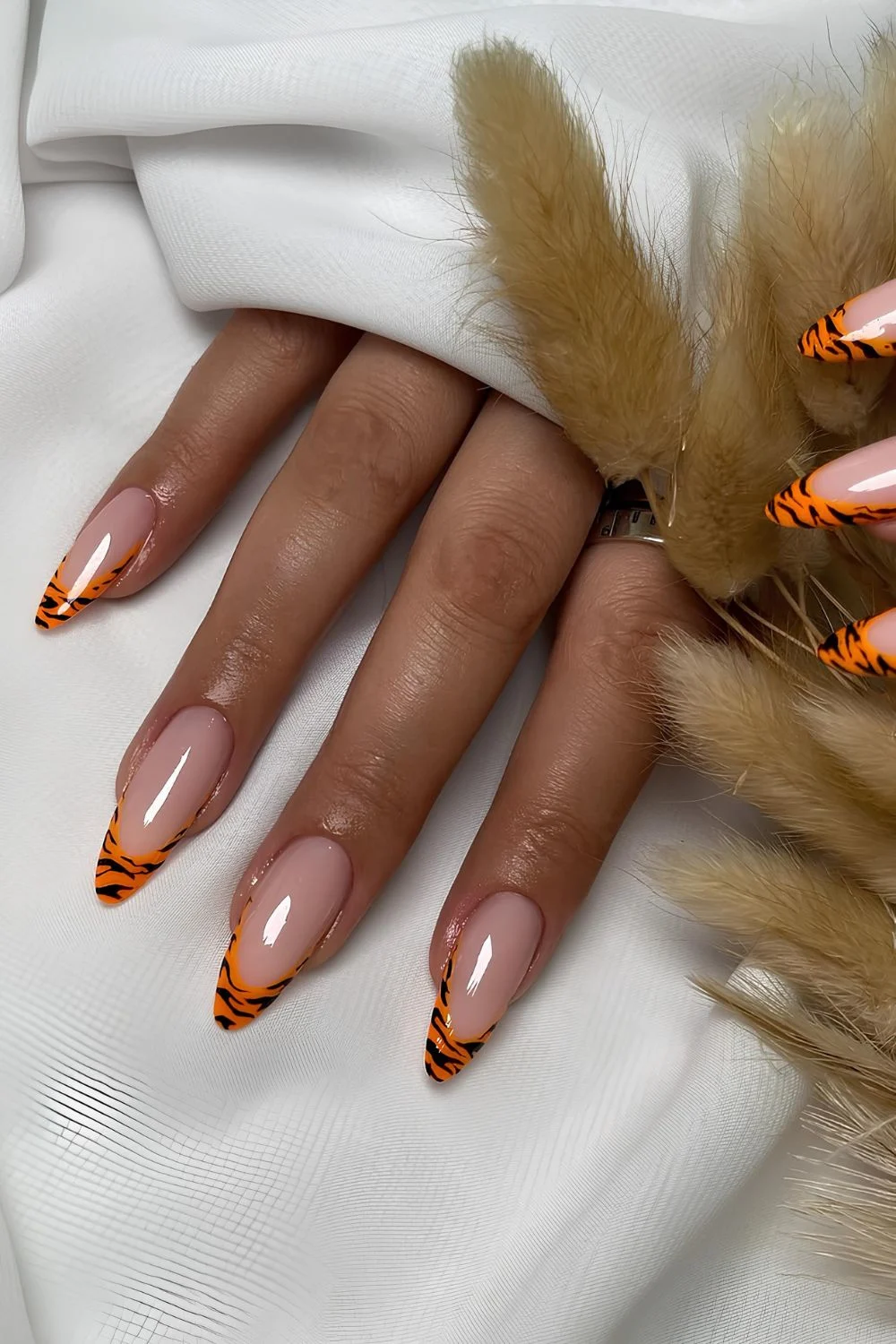 Orange French nails with animal print