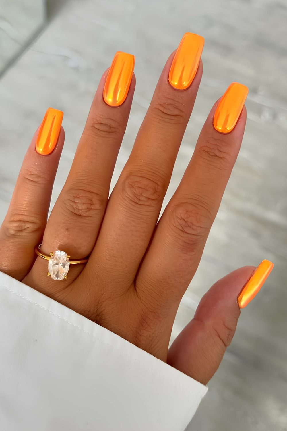 Orange chrome nails