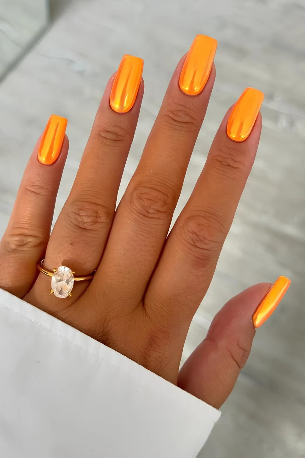 Orange chrome nails