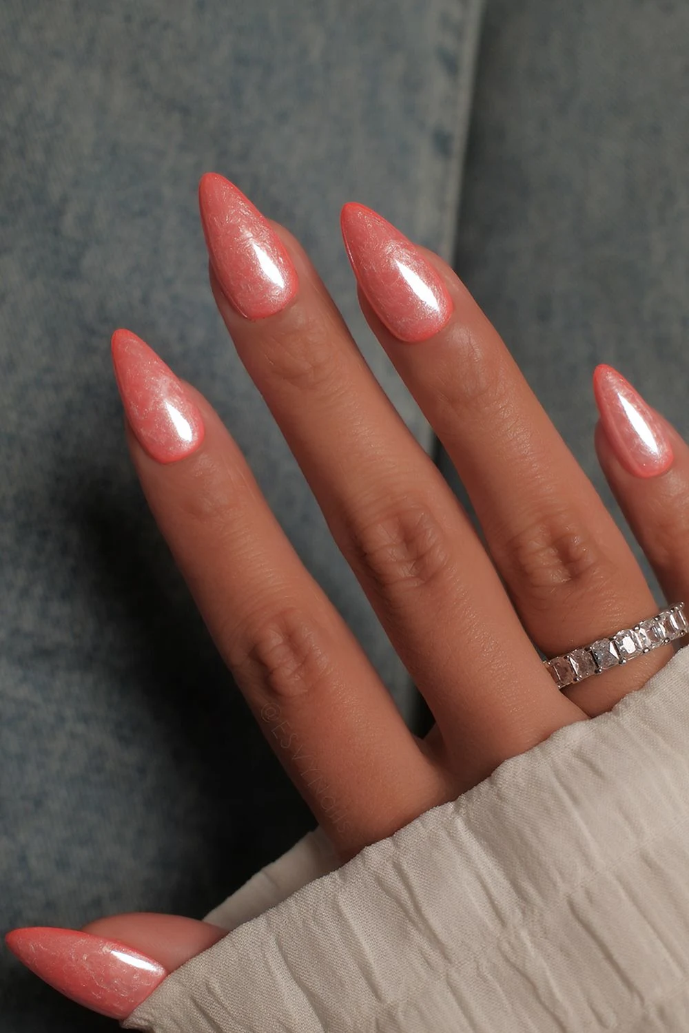 Orange pearl nails with swirl marble effect