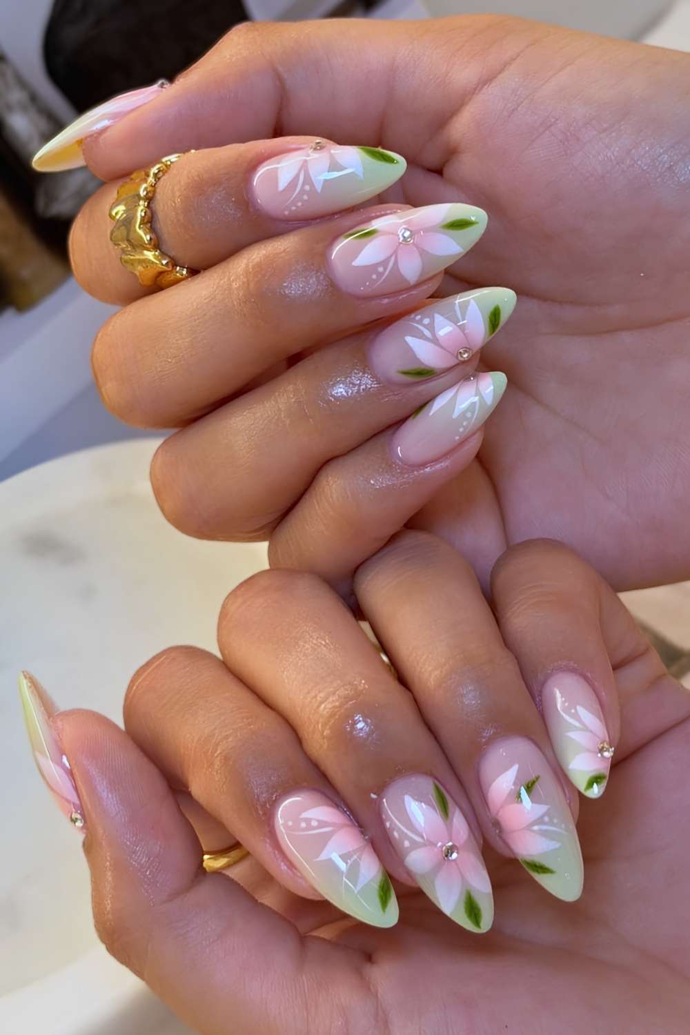 Pastel green ombre nails with pink flowers