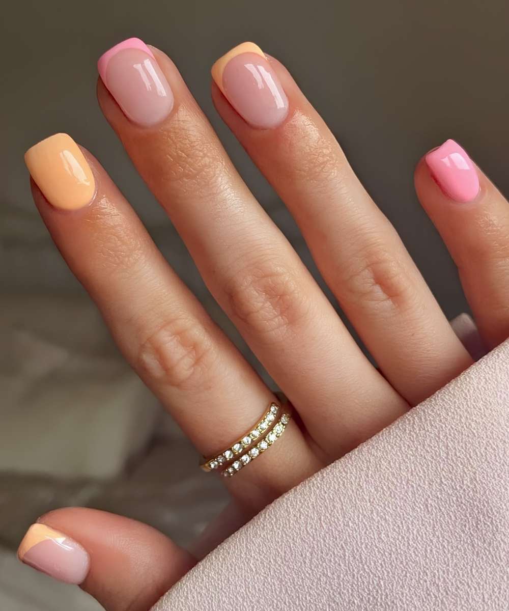 Peach and pink nails with accent French tips