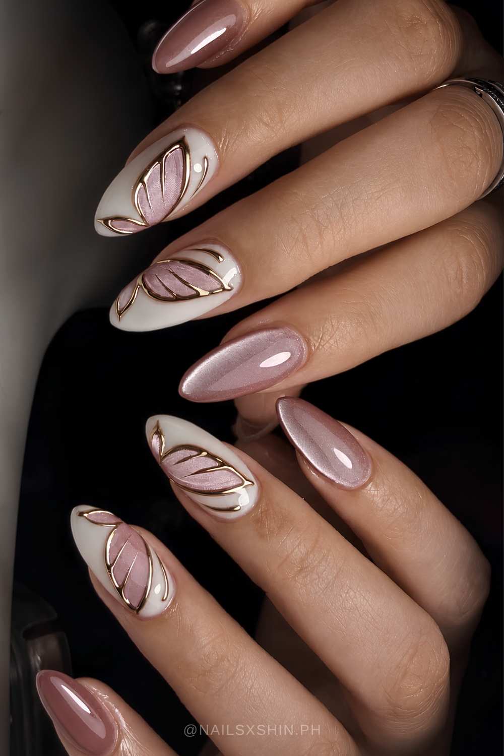 Pink and white cat eye nails with butterflies