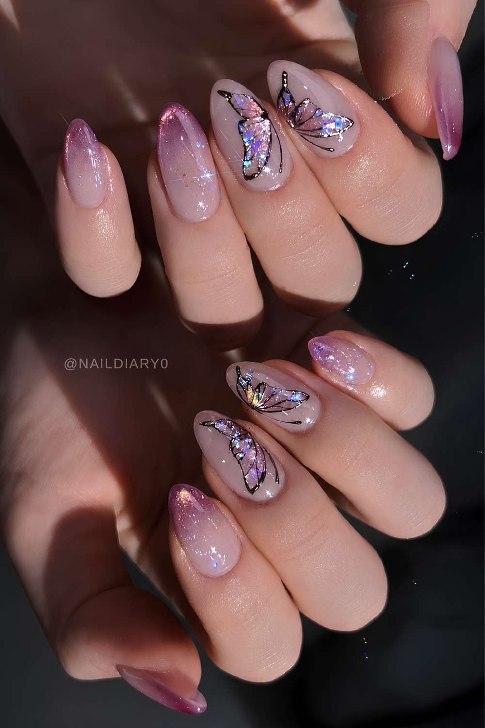 Pink cat eye ombre nails with butterflies