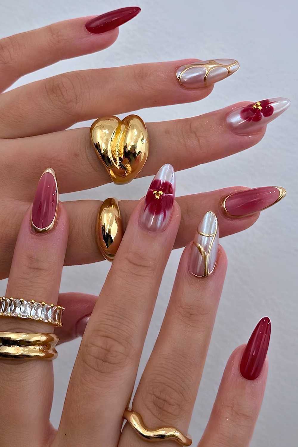 Red and gold nails with blooming gel flowers