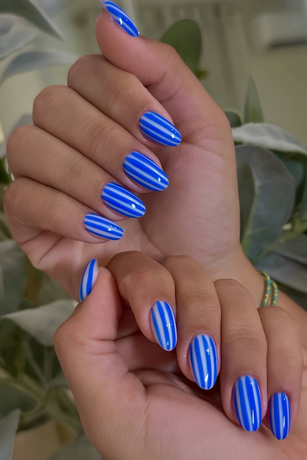 Royal blue and white striped nails