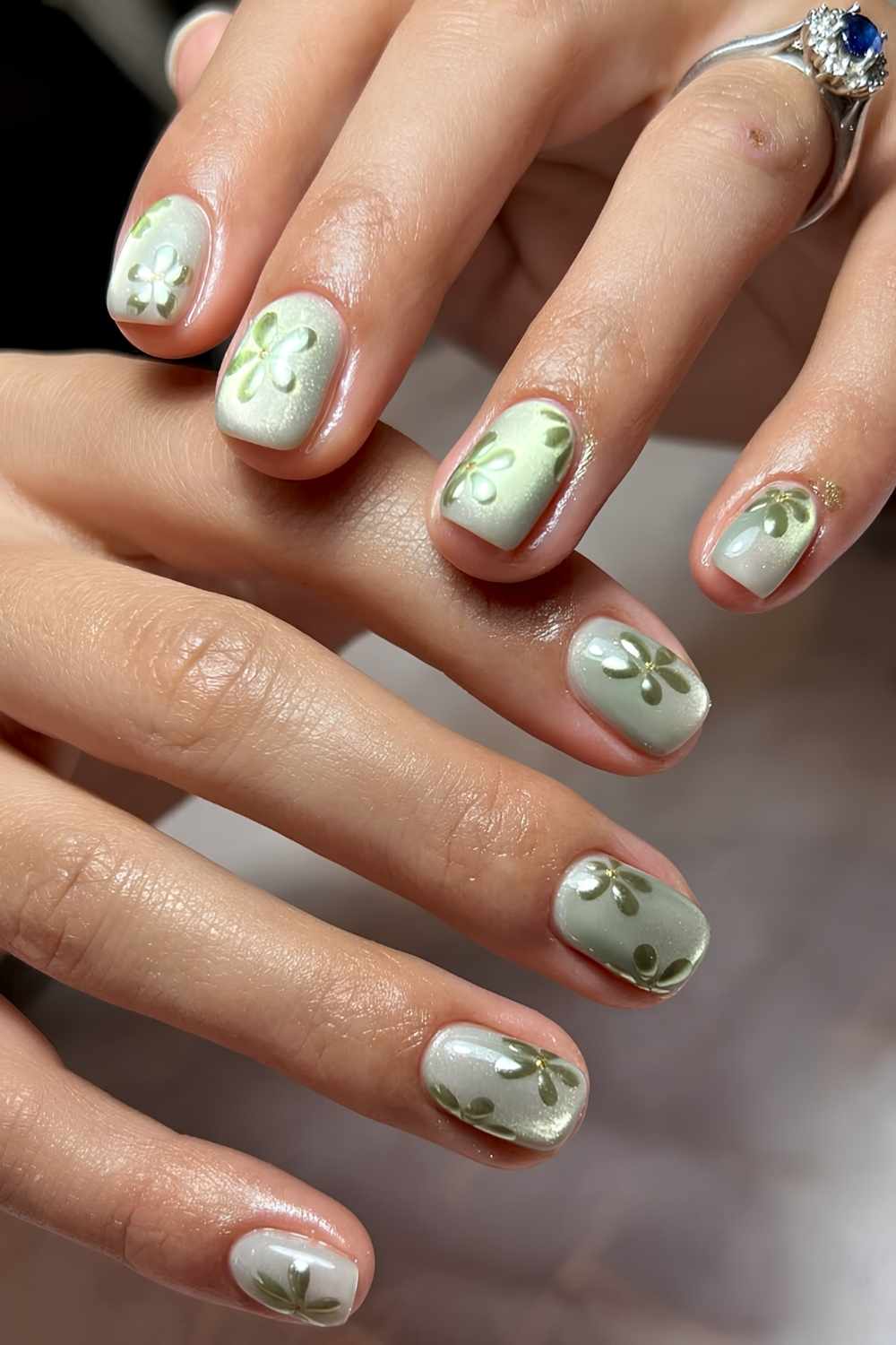 Short green floral cat eye nails