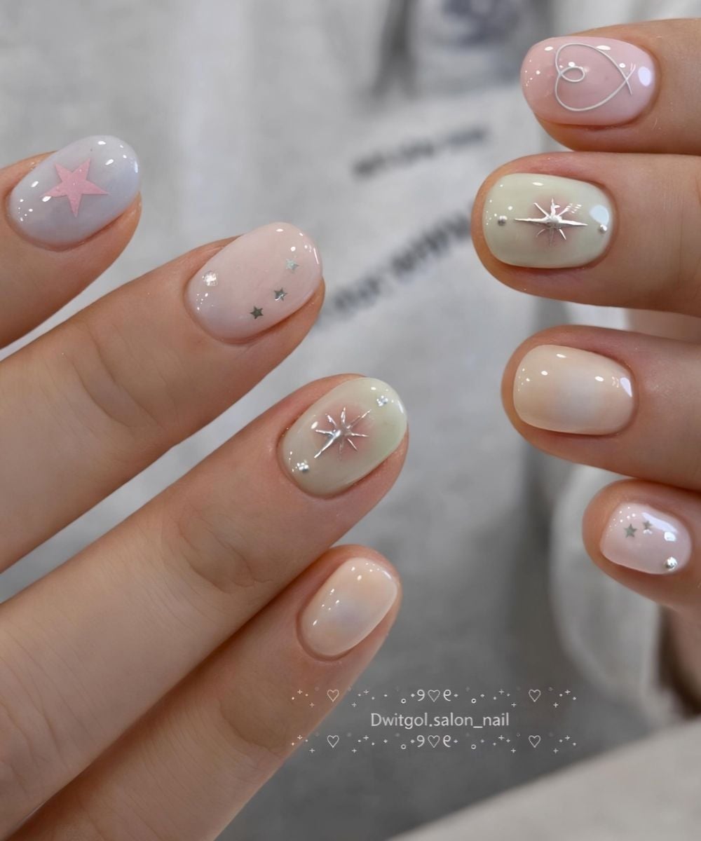 Short pastel nails with stars and hearts
