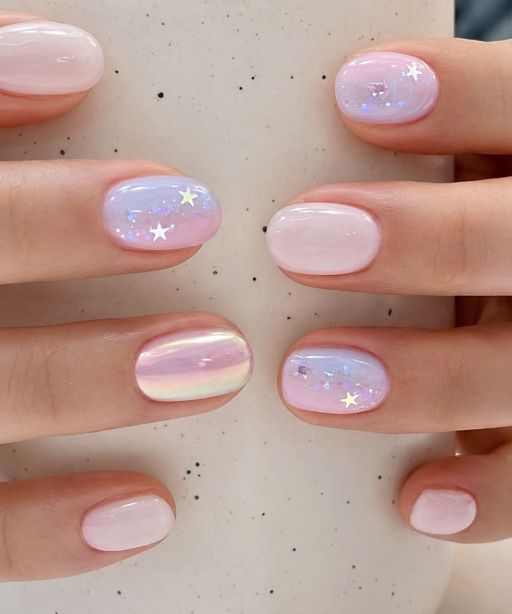 Short pink nails with star decals