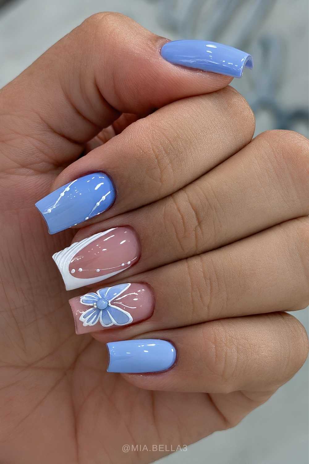 Sky blue and white nails with butterflies