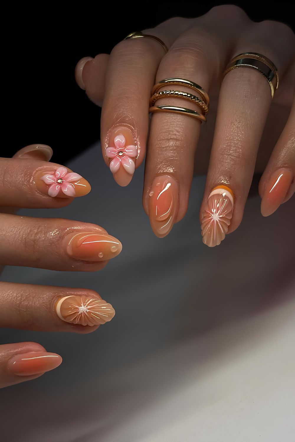 Soft orange nails with 3d design