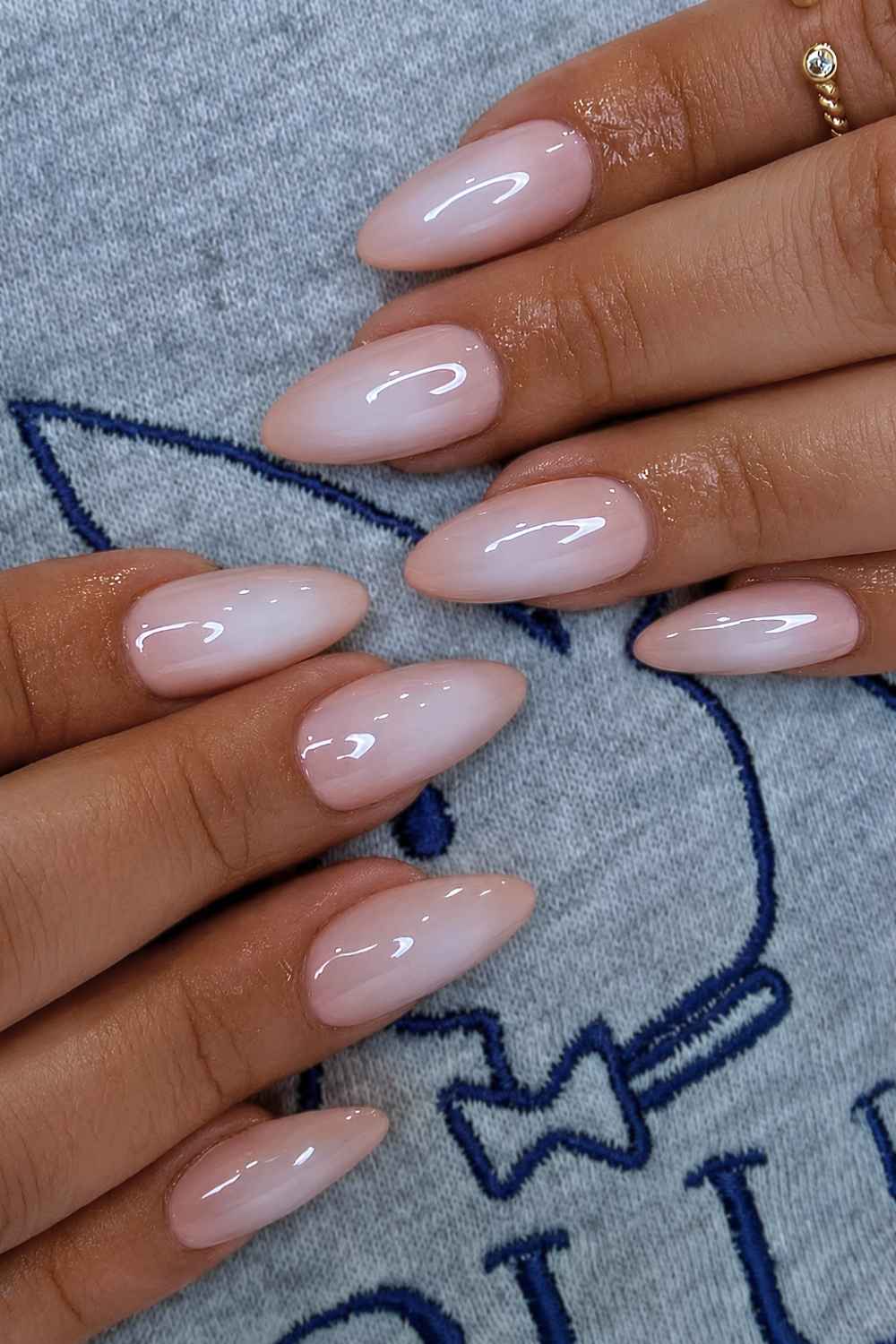 Soft peach and white aura nails