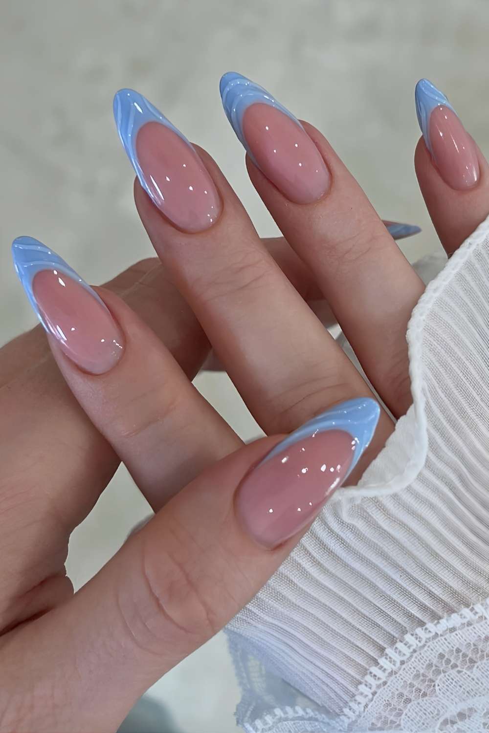 Textured blue French tip manicure