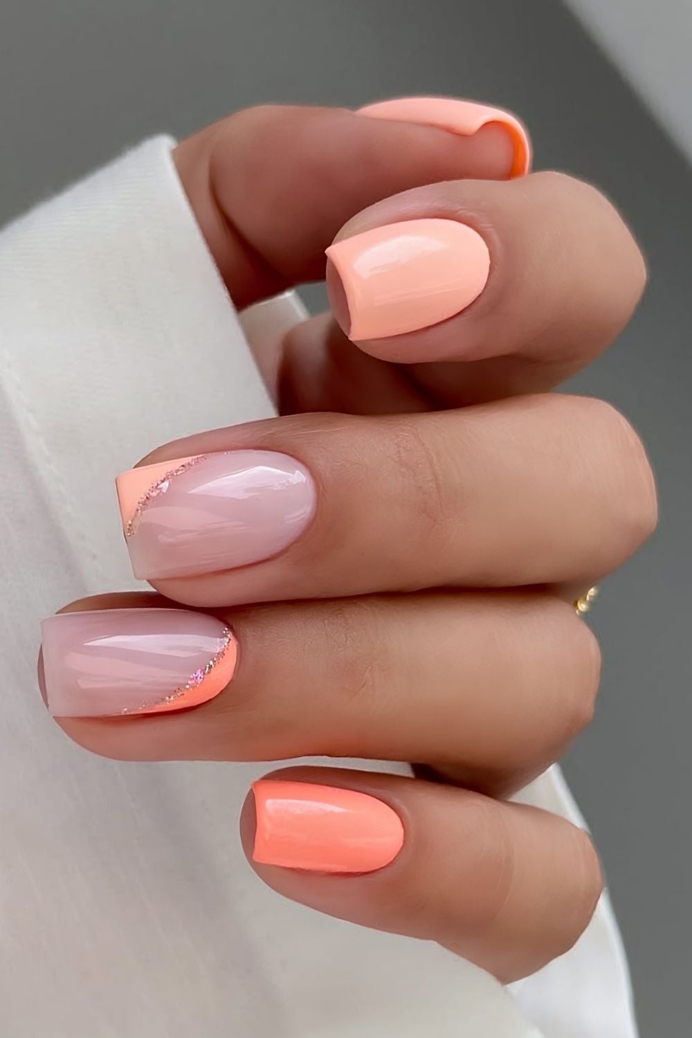 Two tone peach mani with glitter accents