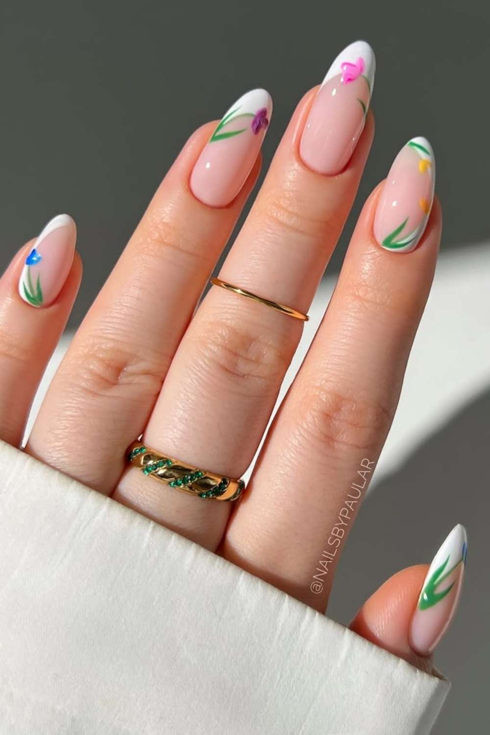 White French nails with colorful tulip art