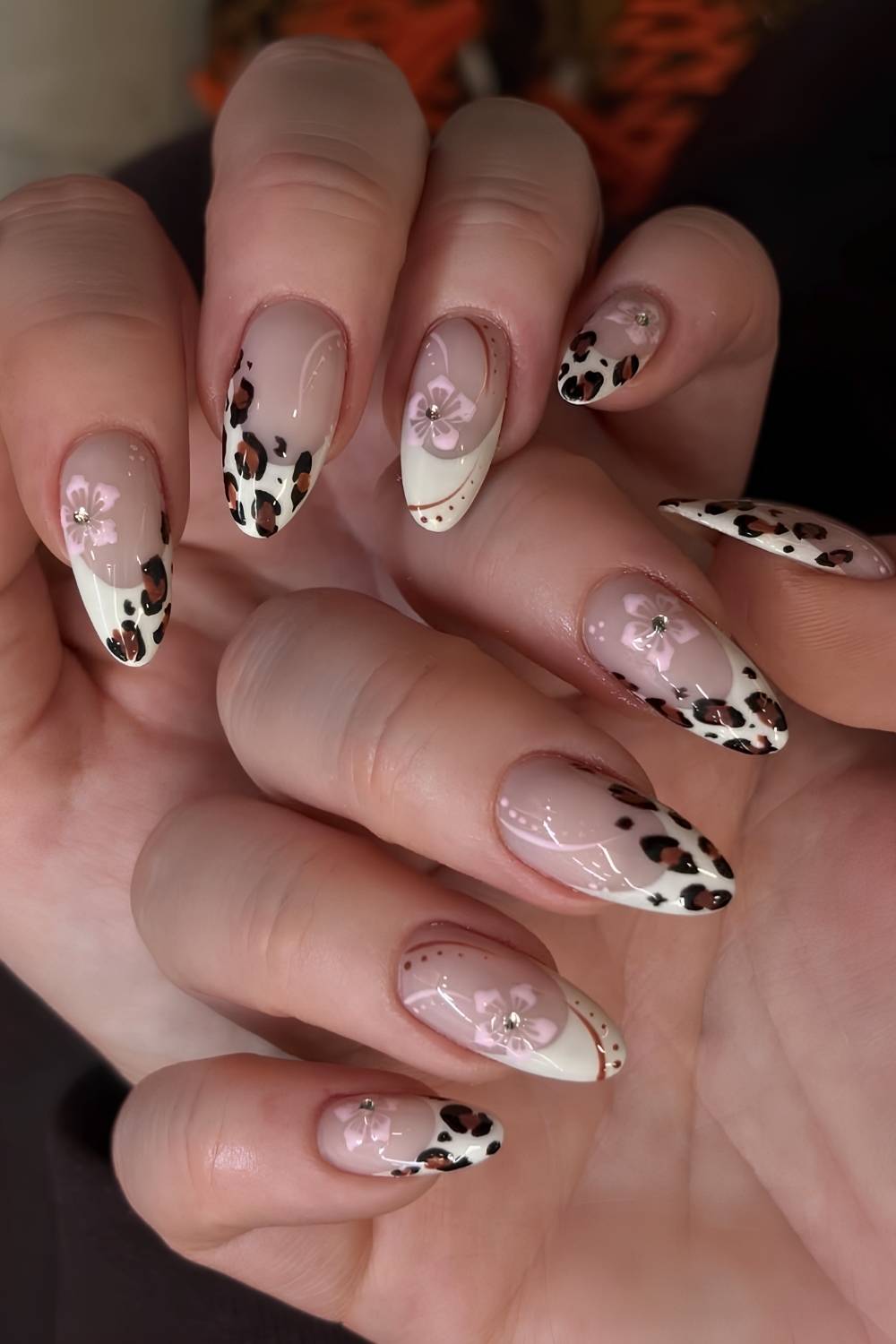 White French nails with floral and leopard print accents