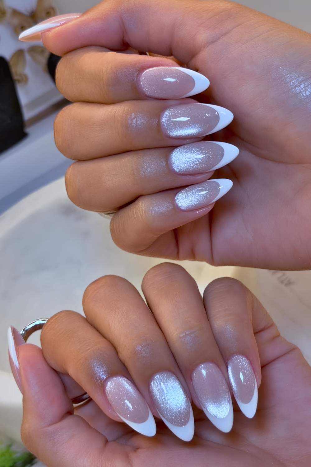 White French tip nails on cat eye base