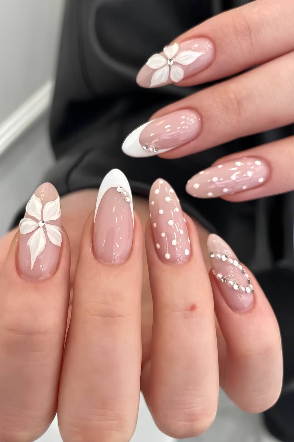 White nails with florals and polka dots