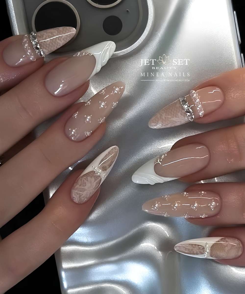 White nails with lace art and gems