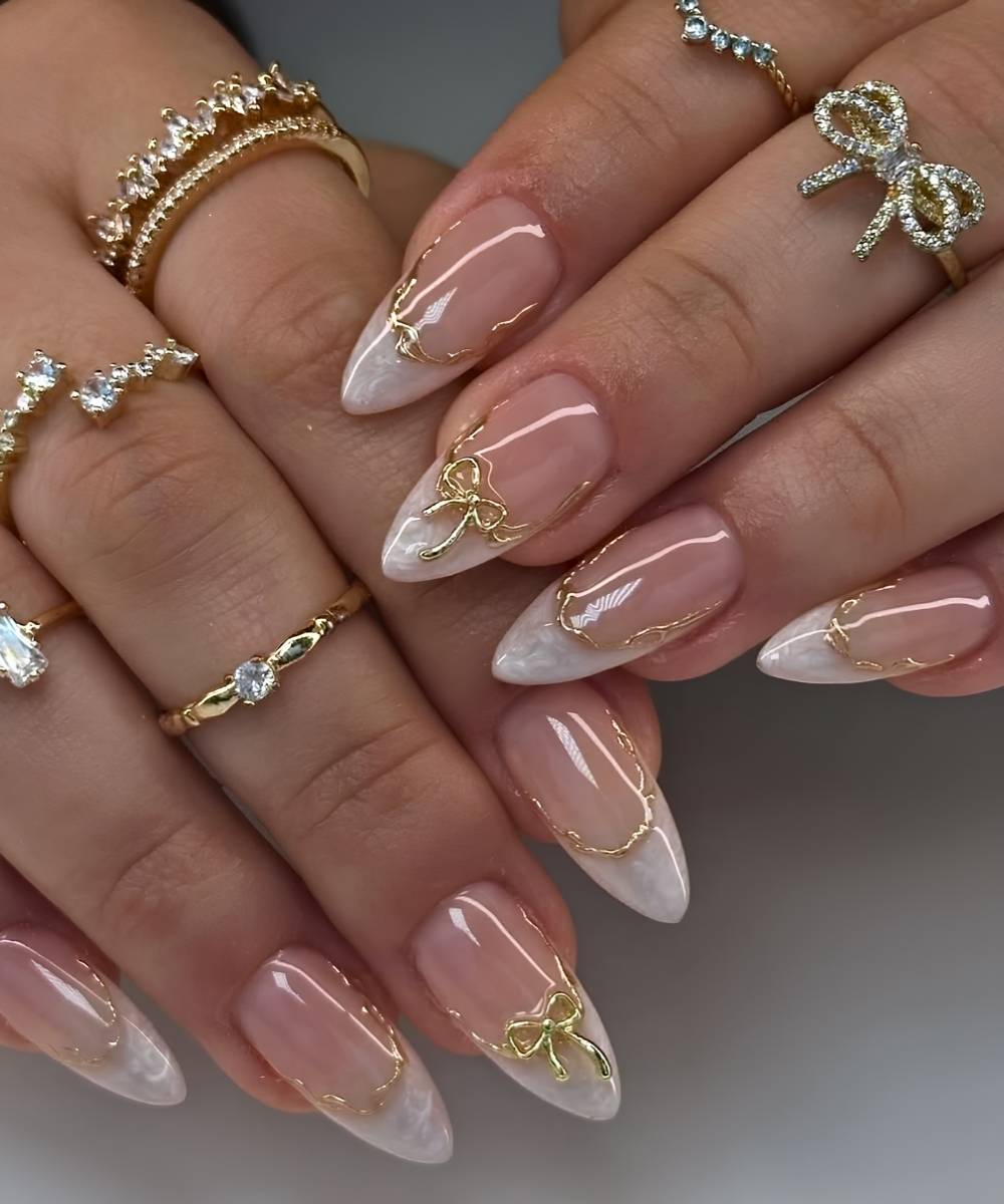 White pearl swirl French mani with bows