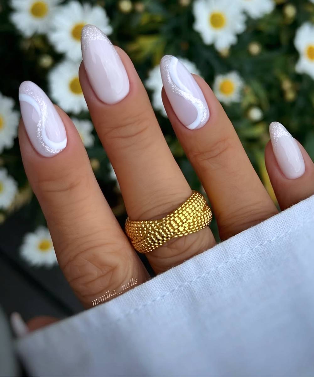 White spring nails with swirls and glitter