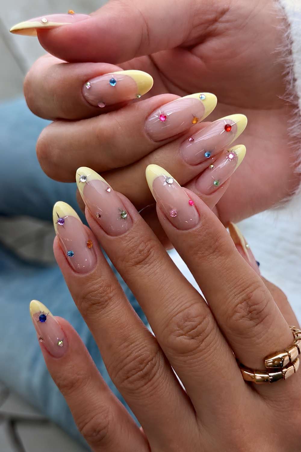 Yellow French mani with colorful gems