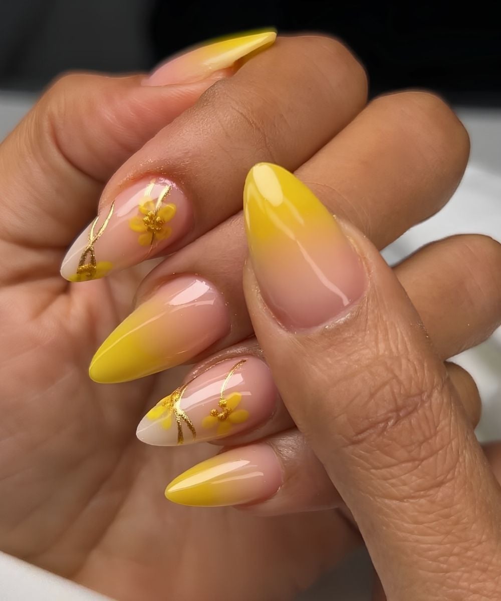 Yellow ombre nails with flowers and gold lines
