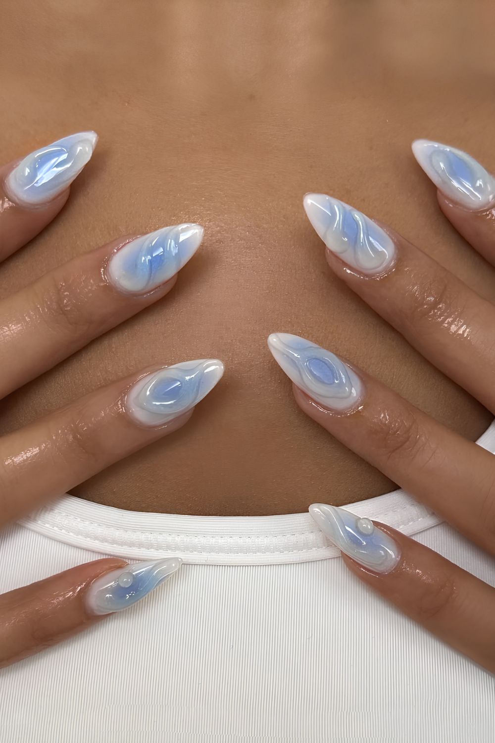 Blue and white aura nails with 3D swirls