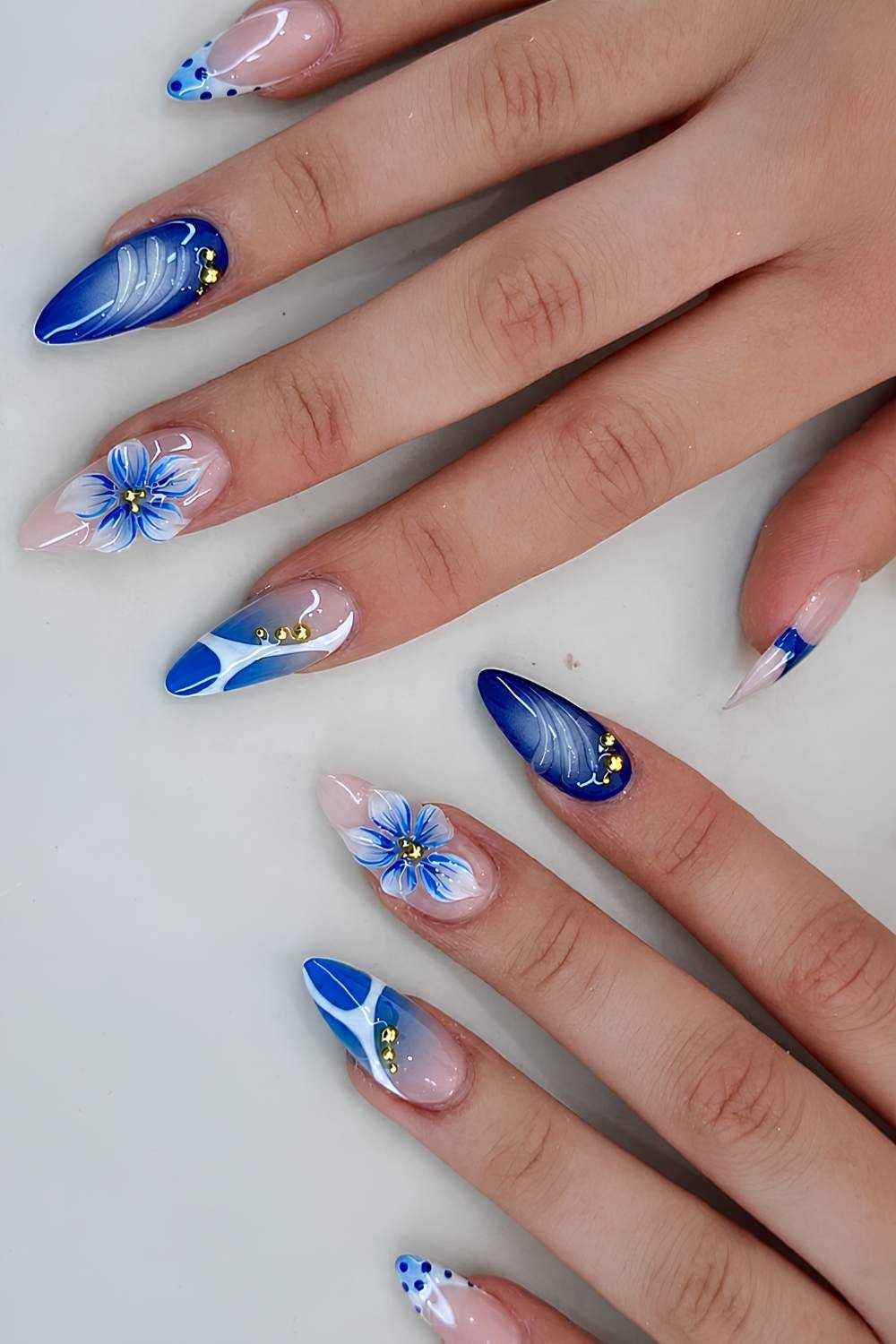 Blue and white mani with 3d florals and line art