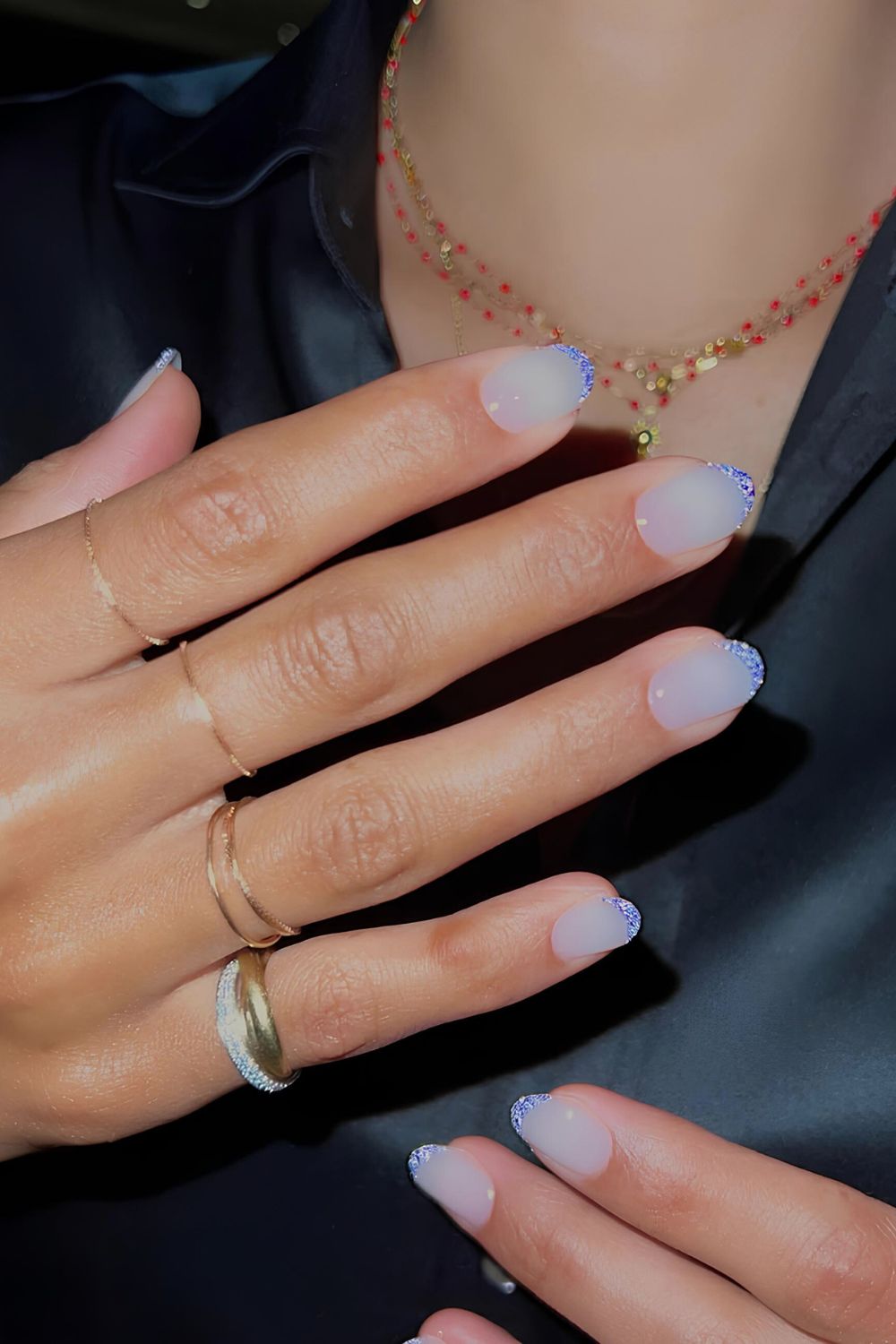 Blue glitter French nails with milky base
