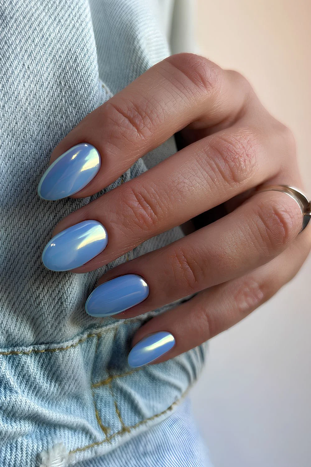 Blue manicure with a reflective chrome finish