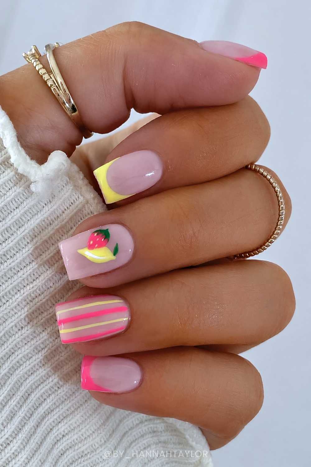 Bold pink and yellow nails with lemon art